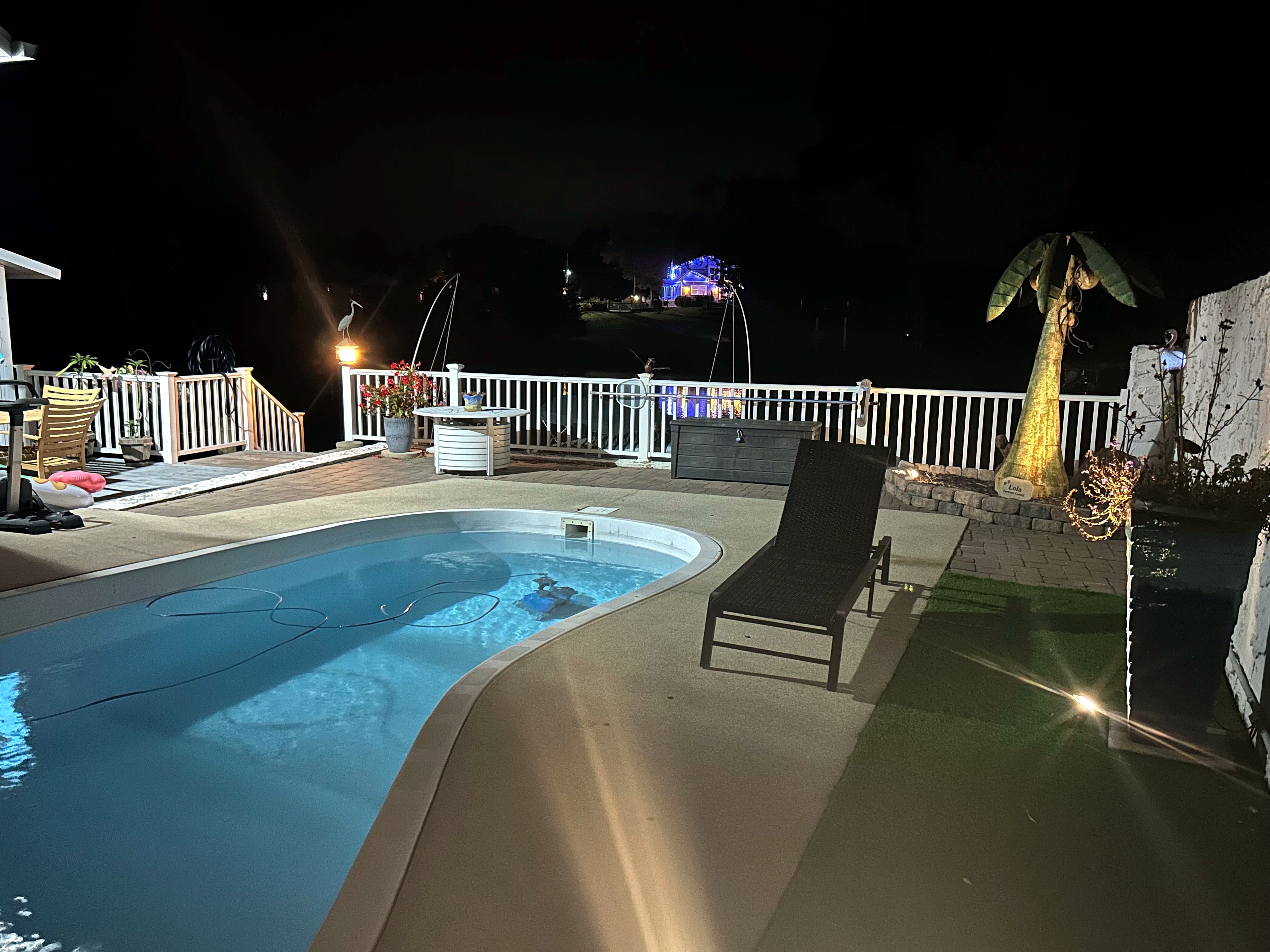 Private swimming pool and outdoor area at night